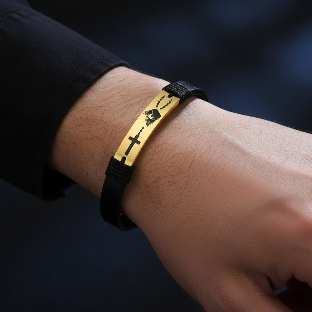 Black leather stainless steel cross bracelet worn on man's wrist