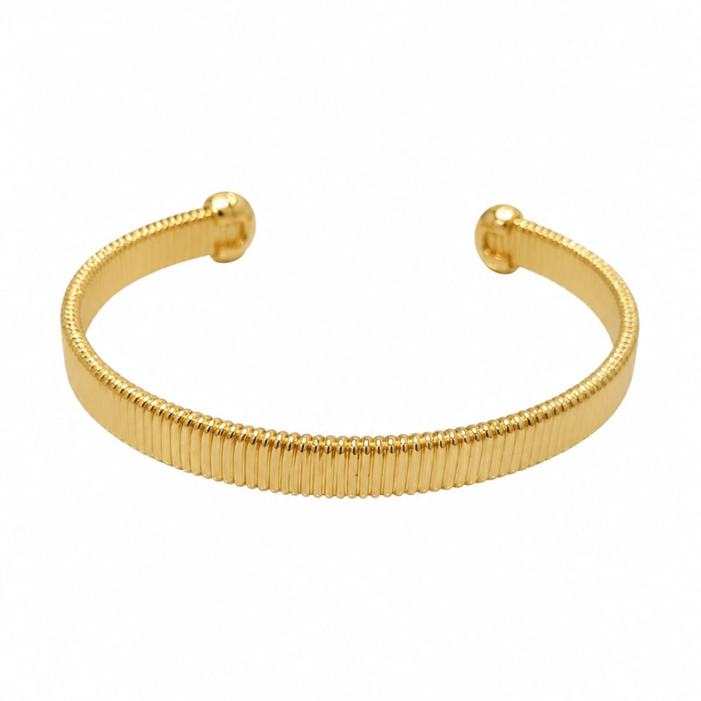 Gold bangle on wrist