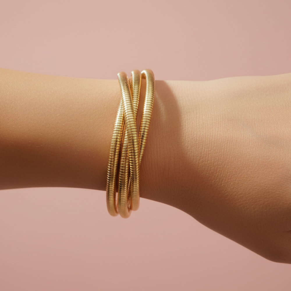Gold plated snake chain bracelet set worn on wrist