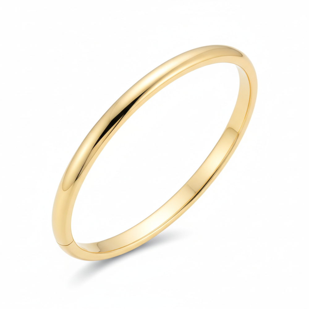 Gold bangle bracelet on white background
