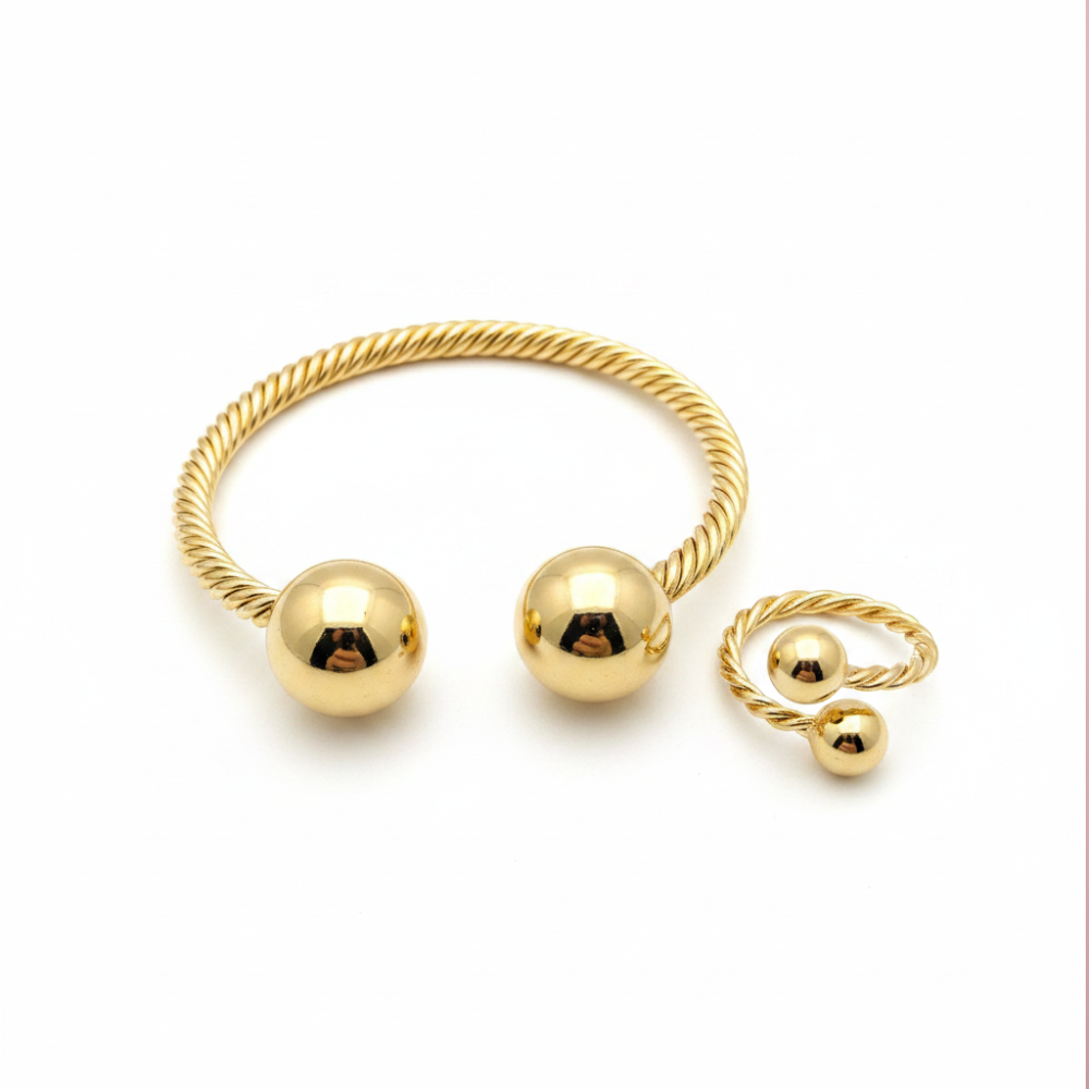 Gold twisted rope bangle and ring set on white background