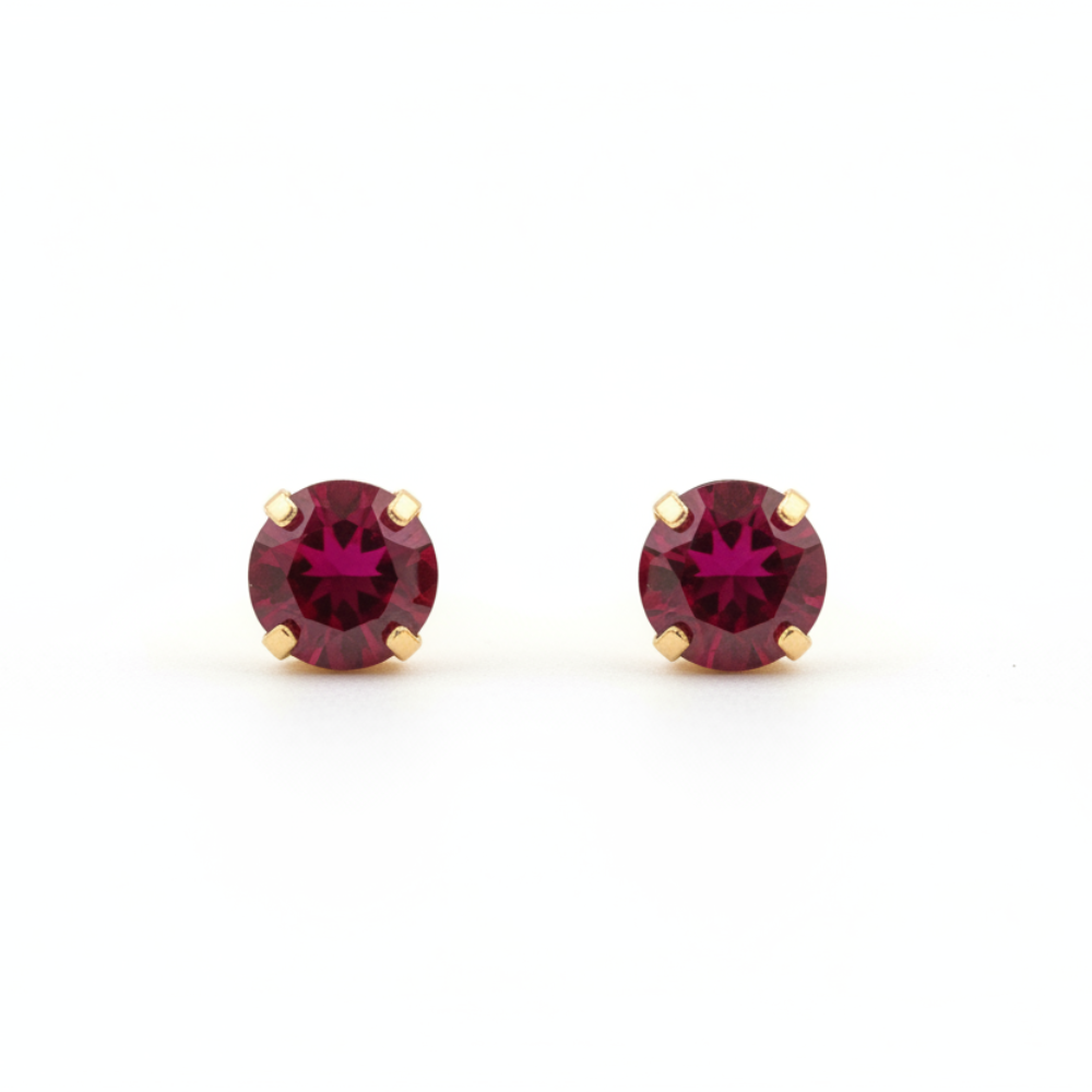 Ruby crystal stud earrings 6mm gold prong setting on white background