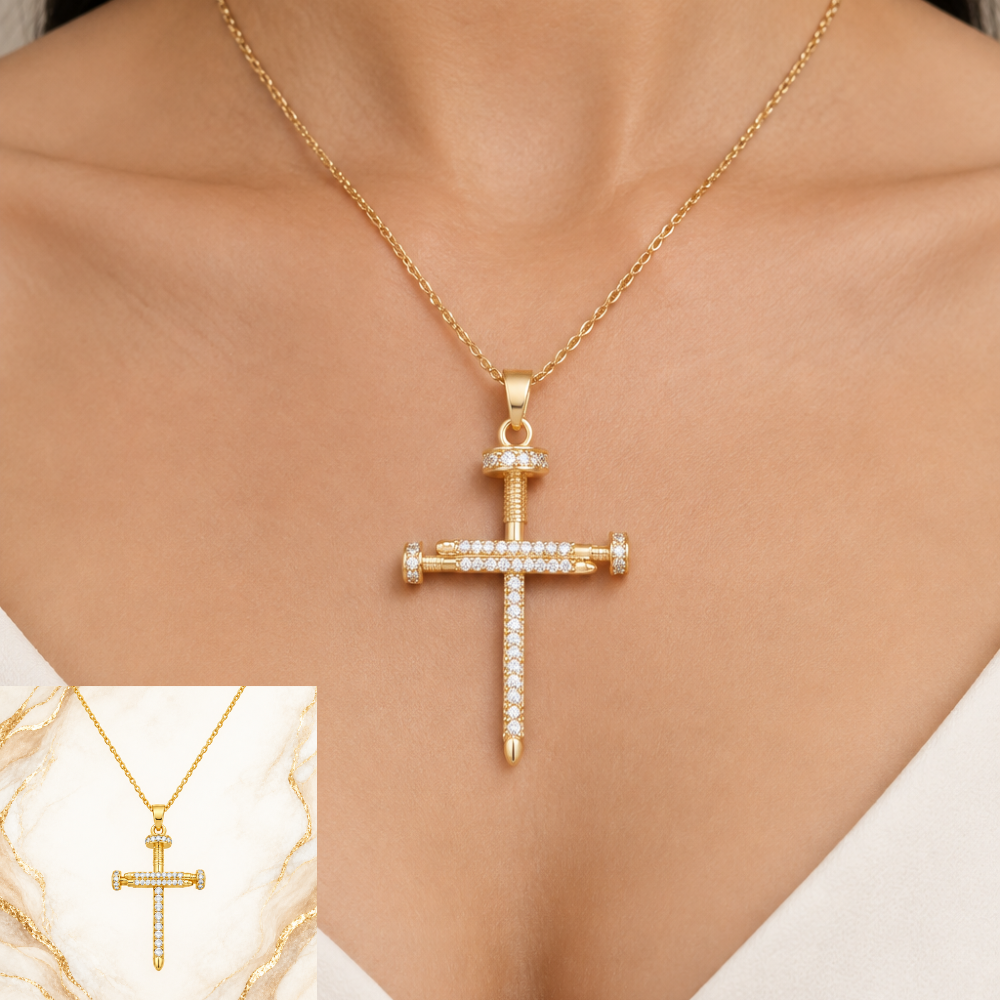 Gold-plated stainless steel crucifix nail cross necklace worn on a model