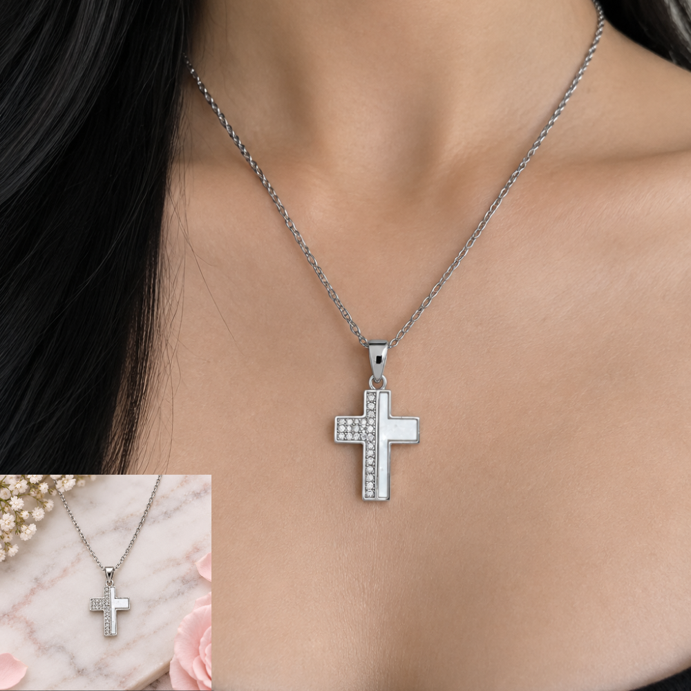 Silver-tone stainless steel Latin cross necklace worn on a model