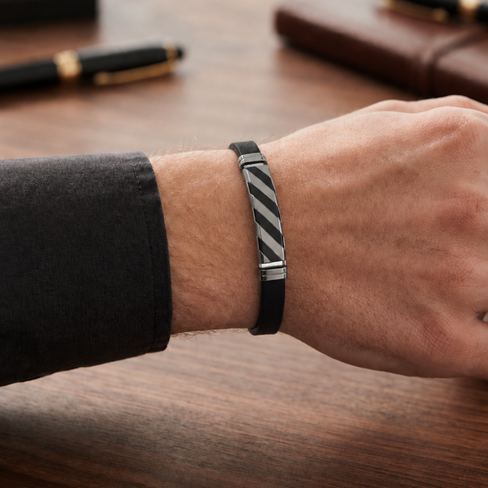 Black and silver men's leather bracelet worn on the wrist