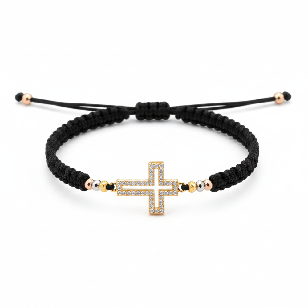 Gold cross bracelet flat lay on white background