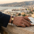 Men's Cedar Tree bracelet worn on wrist with Beirut cityscape in background