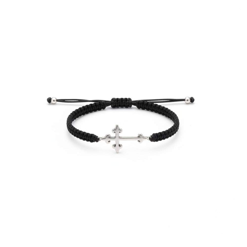 Silver cross bracelet on white background