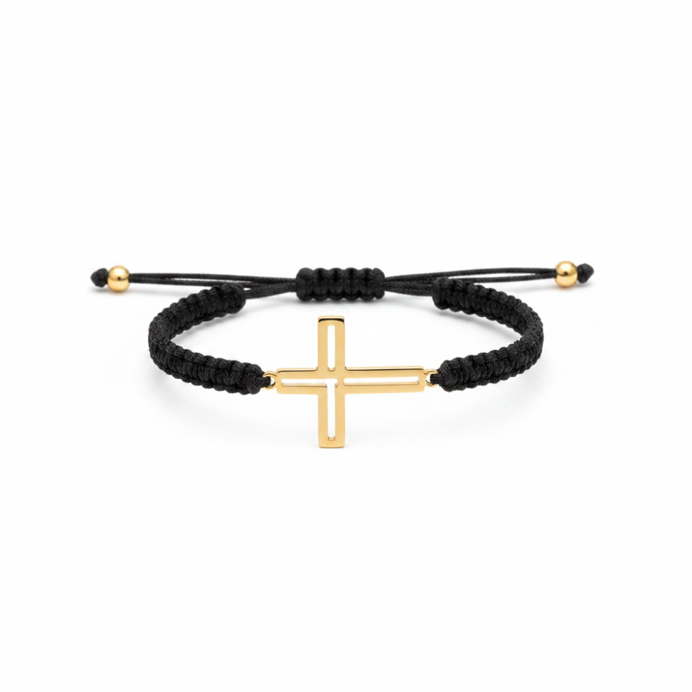 Open cross bracelet gold plated on black macramé cord white background
