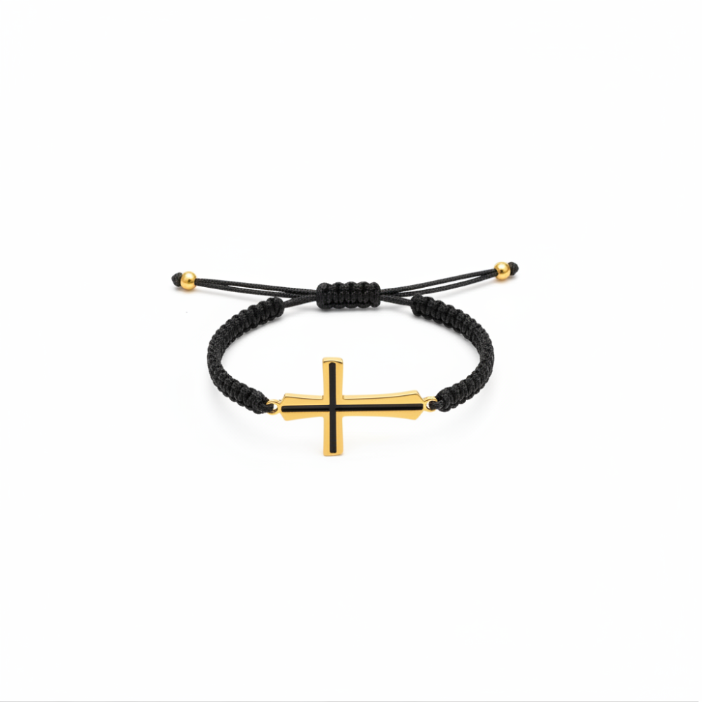 Black enamel cross bracelet gold plated on black macramé cord white background