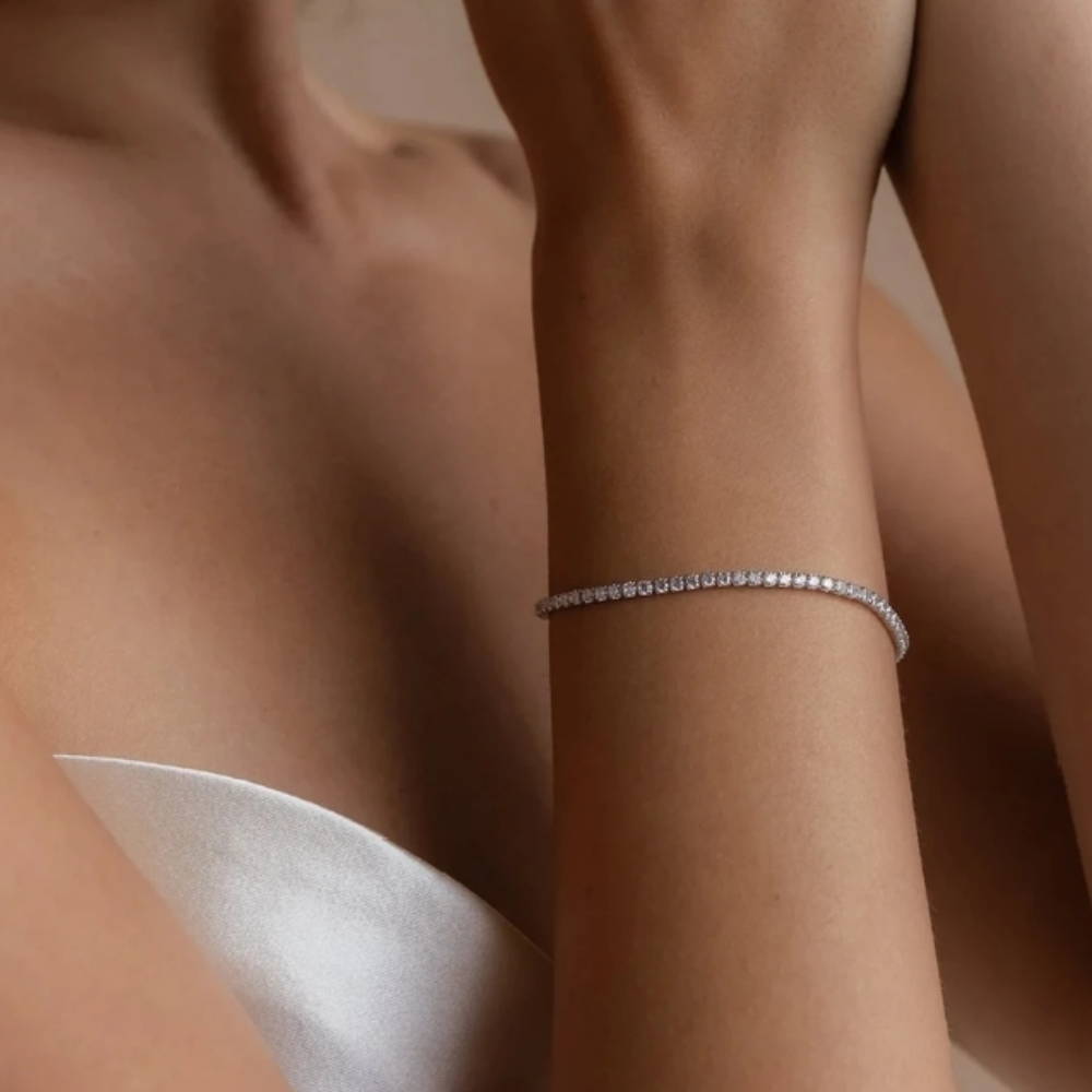 Silver tennis bracelet on woman's wrist