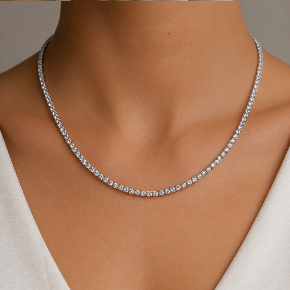 Silver tennis necklace on a woman's neck
