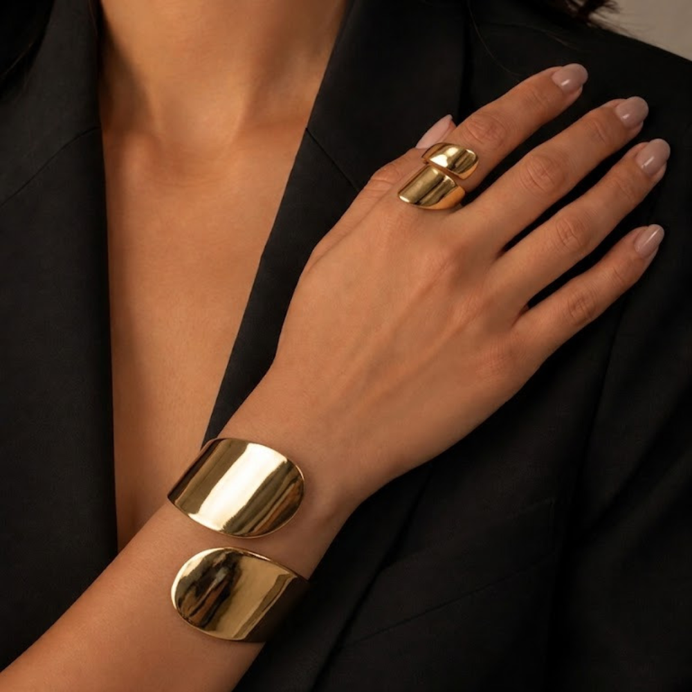 Gold stainless steel cuff bracelet and ring worn on wrist