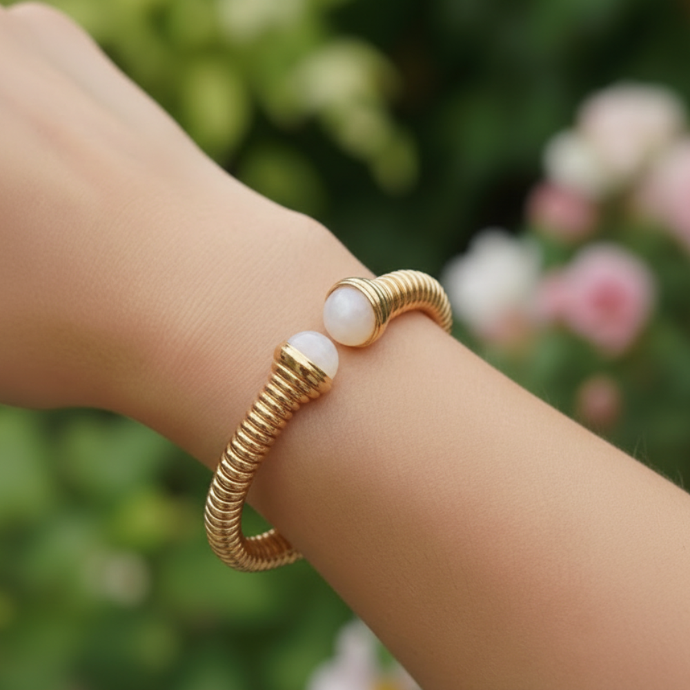 Pearl bangle on wrist