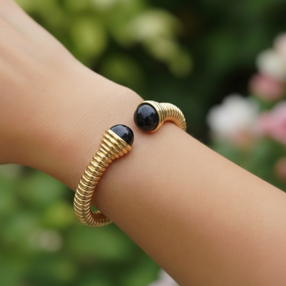 Black stone bangle on wrist