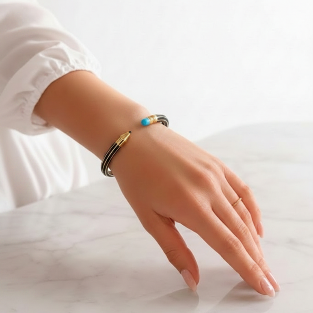 Pencil bangle bracelet black with turquoise eraser on wrist